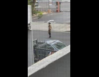 Woman in police costume tiktok dance on the street