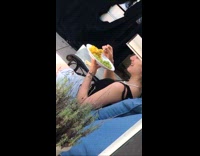 Man shows woman eat rice with grapes