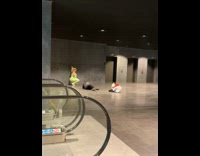 Collab IITW - Woman in neon green crouches beside the wall for a photo