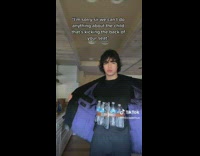 Man Shows Bottled Water and Remote Control on Him