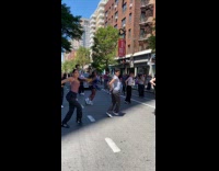 Group dances Fame in middle of road