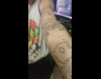 Man shows arm with tattoo traces for completion