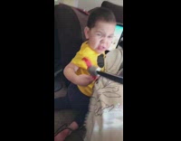 Little boy angry after foot is grabbed with toy 