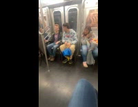 Collab Subway Creatures - Two men sit chair in subway train