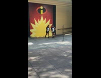 Two women in black tiktok dance at Disneyland