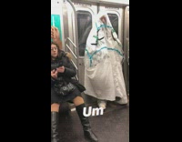 person in all white suit taped together face seen