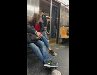 man brown jacket signing subway doors open