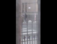 Black jacket blue face mask guy dances 