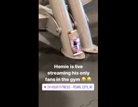 Guy at indoor gym streams workout live  