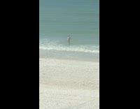 Man shirtless fights ocean for beach video
