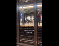 Man plays djembe drum at train station
