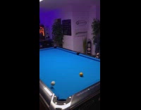 Guy billiards trick shot cue ball jump on rail
