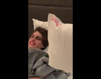 Black striped shirt guy red lipstick bed 