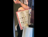 Man reads article in magazine called The Penis Diet on subway train