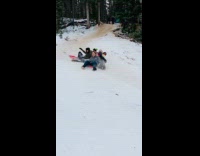 Family does group sledding