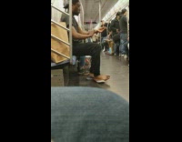 (DUPLICATE) Shoeless Man Purells Hands and Feet on Subway