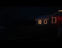 Neighborhood houses with dancing Christmas lights show