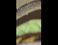 Cat inside bag rolls off table 