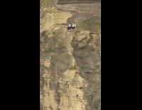 Two girls cliff edge for photo
