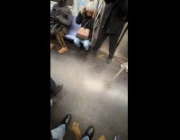 Man hold speakers like gun dance subway