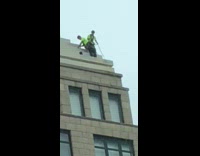  Neon vest high building tower window cleaners