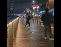 Man long hair black shirt dance park