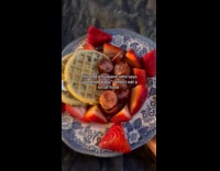 Husband serving wife breakfast in bed