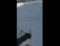 POV of skiier going down steep slope