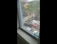 Firetruck trying to pass on a small residential street blocked by car