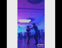 Couple practice bachata dance girl blocks phone 
