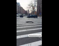 Deep manhole pothole in the middle of crosswalk