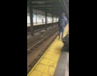 Musicians play cello and violin across platforms in subway station