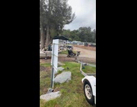 Elderly man pulling boat with electric wheelchair 