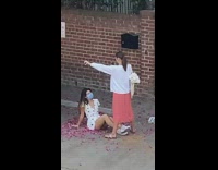 Girl white dress sit ground flower petals