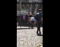 Man black shirt dub voice on the sidewalk