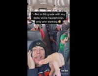 Guy dances on bus green screen headphones 