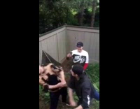 Black sweater guy punches friend in face