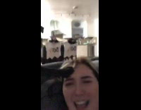 Little black dog push girl head paw 