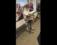 Collab Subway Creatures - Musician plays keyboard and squishes squeaky toy in subway station