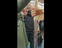 woman with tissue paper in hand holding pole