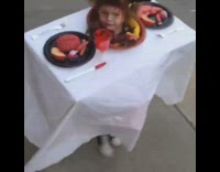 Baby dresses up as table with brains costume