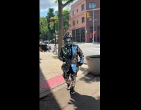 Man wears suit with small square mirrors