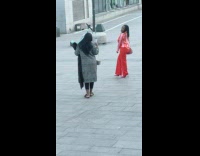 Woman in pink poses in Stockholm 