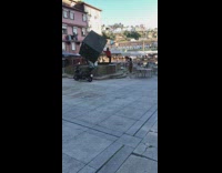 Girl sweater dance large black cube fountain