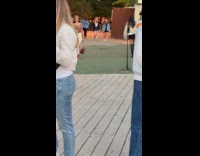 Woman poses with controlled phone on tripod