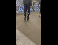 Woman skate shoes climb stairs train station