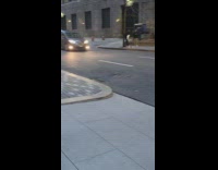 Man skateboards while the videographer also skateboards