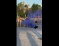Man violin violet smoke bomb lake sunset