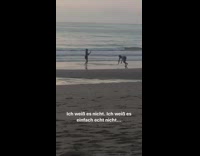 Guy lays on back beach shore pt. 2