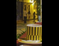 Two women with facemask tiktok dance in the alley